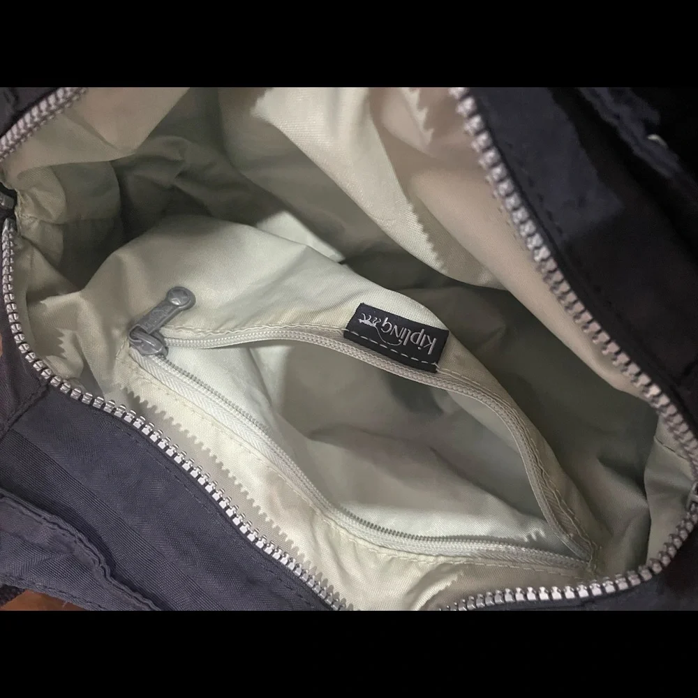 Kipling crossbody hand bag. Bluish purplish Color. Used - Picture 2 of 8